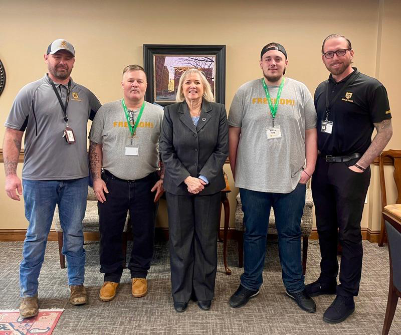 Men of Valor pictured with Becky Massey.
